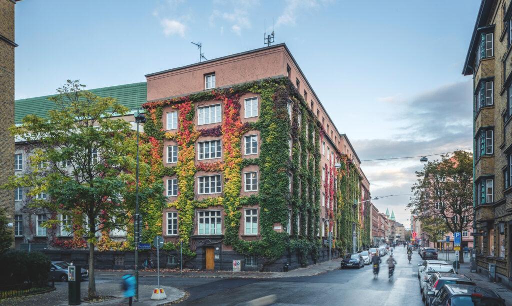 A city street with bicycles riding down it.