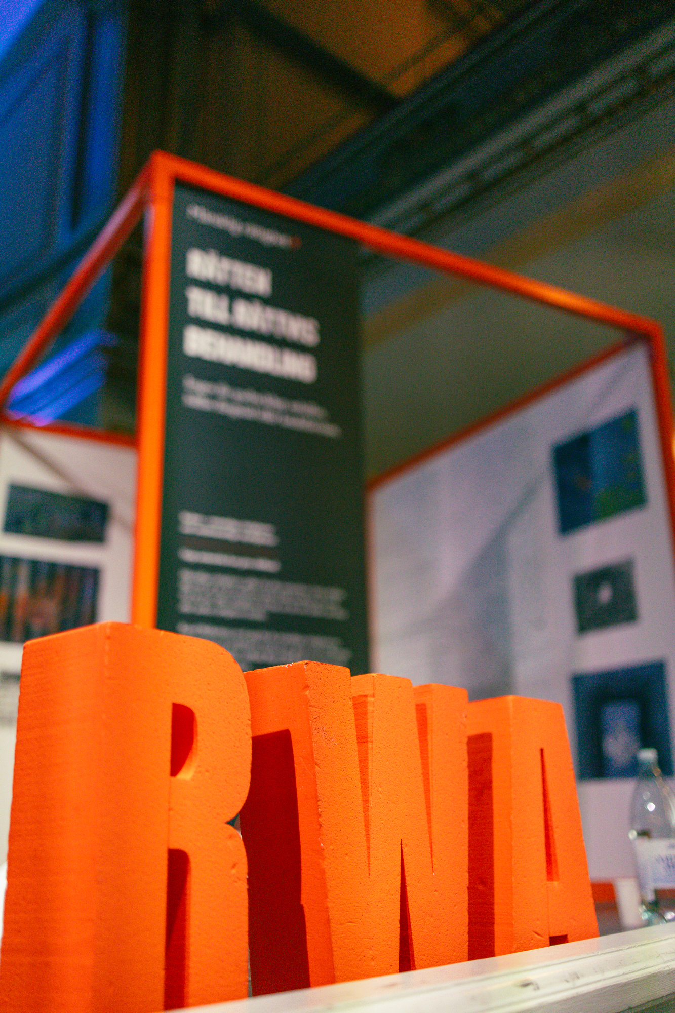 An orange metal cube and the text RWA.