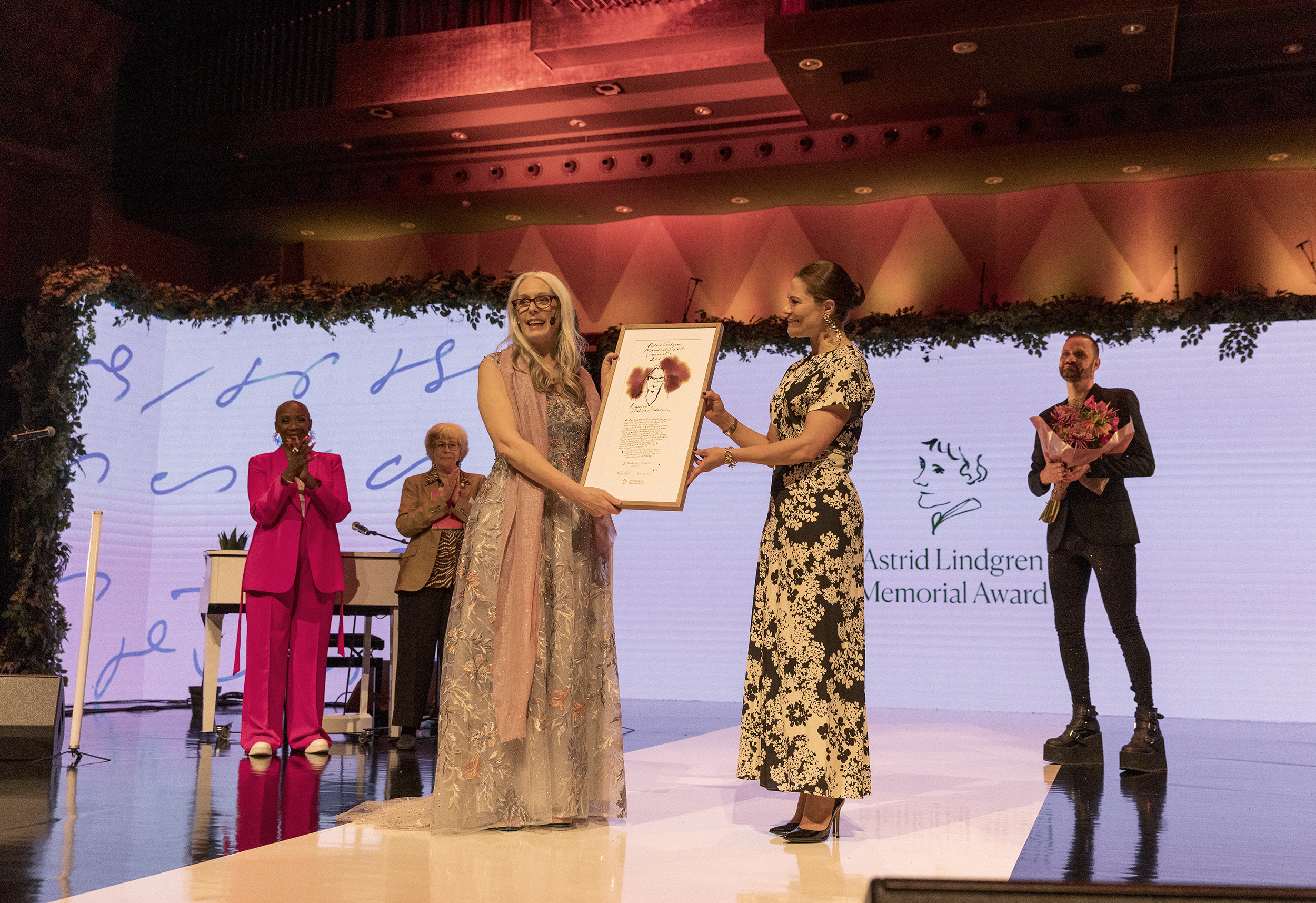 The crown princess presenting the ALMA award to Laurie Halse Anderson.