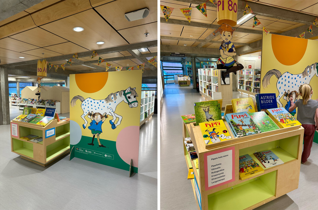 A Pippi cutout board, books and decorations at a library.