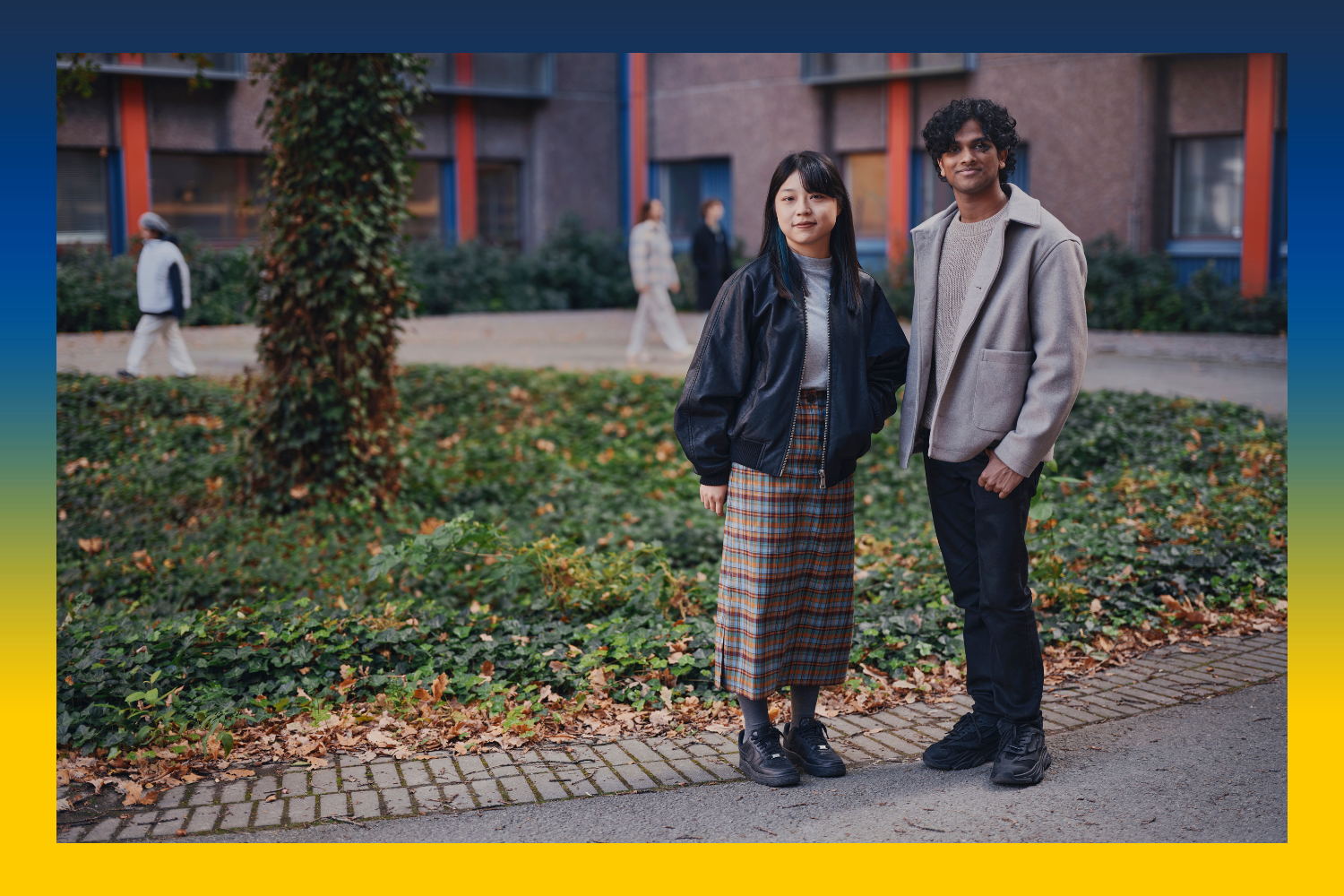 Two students outside a university.